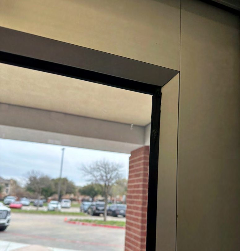 Hand-cut film, stopped short of the edge: Attachment laid against the edge of the film and the frame instead of across them.