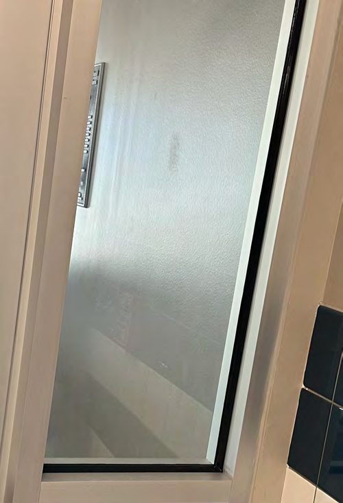 Correct security film installation by Epic: Continuous bead, hardware removed and reinstalled.